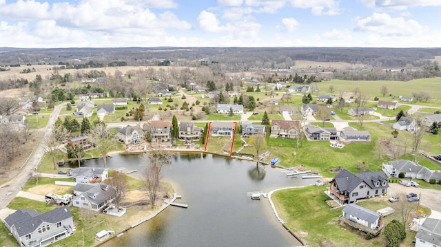 bird's eye view featuring a residential view and a water view