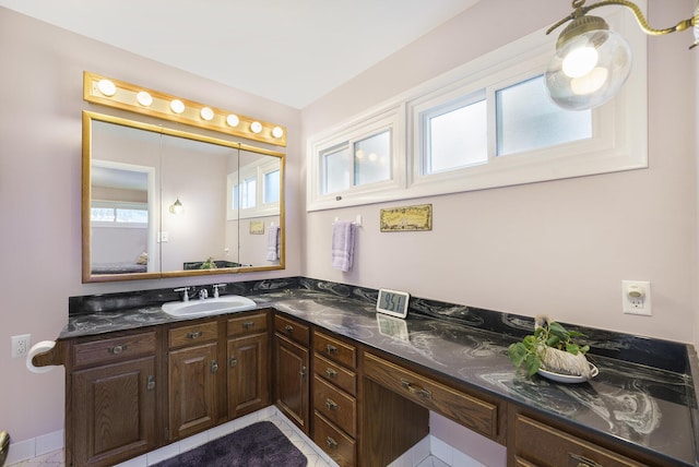 52473 Sheridan Rd, Paw Paw, MI 49079 - bathroom with healthy amount of natural light, vanity, and tile patterned flooring