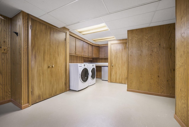 52473 Sheridan Rd, Paw Paw, MI 49079 - laundry room with washing machine and clothes dryer, cabinet space, and wood walls
