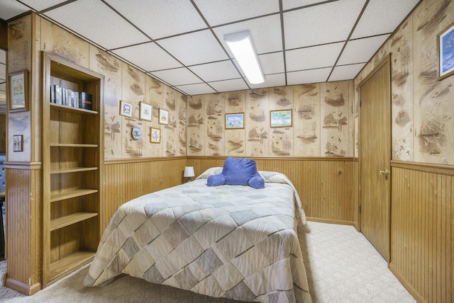 52473 Sheridan Rd, Paw Paw, MI 49079 - bedroom featuring carpet flooring, a paneled ceiling, wainscoting, and wooden walls