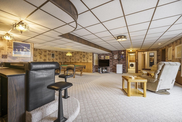 52473 Sheridan Rd, Paw Paw, MI 49079 - carpeted living area with bar, wooden walls, washer / clothes dryer, a paneled ceiling, and billiards