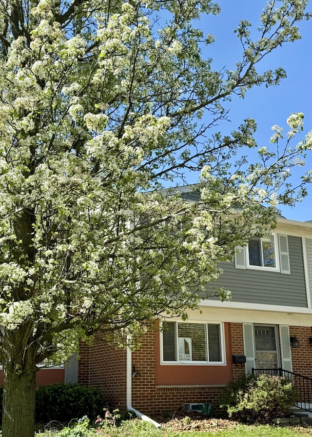 view of front of property featuring brick siding