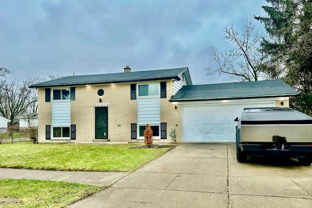 raised ranch with a front yard, brick siding, a chimney, a garage, and driveway