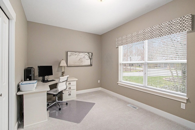 office space with visible vents, baseboards, and carpet flooring