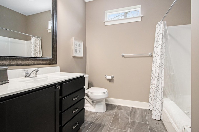 bathroom featuring toilet, baseboards, shower / tub combo with curtain, and vanity