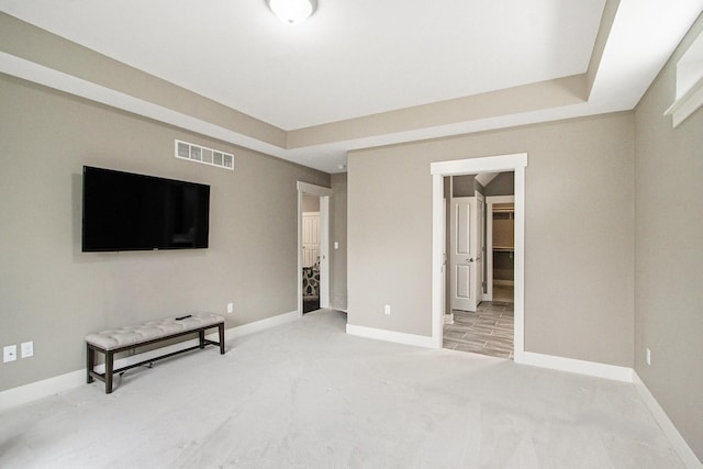 interior space featuring light carpet, baseboards, and visible vents