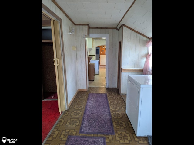614 S Saginaw St, Lapeer, MI 48446 - laundry room featuring wooden walls, ornamental molding, and tile patterned floors