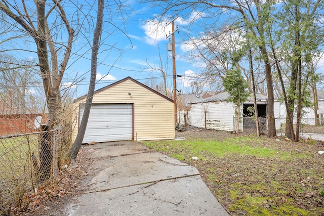 9233 Mckinney St, Detroit, MI 48224 - detached garage with fence and driveway