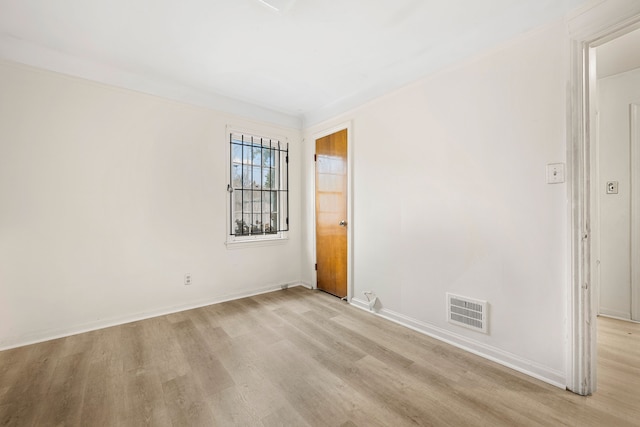 9233 Mckinney St, Detroit, MI 48224 - empty room with light wood-type flooring, baseboards, and visible vents