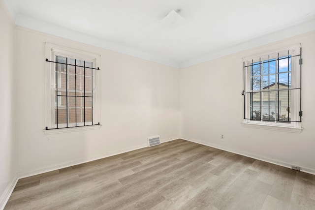 9233 Mckinney St, Detroit, MI 48224 - unfurnished room featuring visible vents, baseboards, and wood finished floors