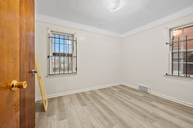 9233 Mckinney St, Detroit, MI 48224 - unfurnished room featuring visible vents, baseboards, and wood finished floors