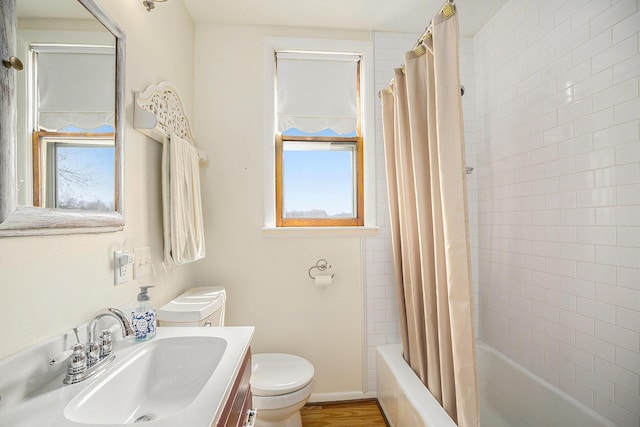 full bath with shower / bathtub combination with curtain, wood finished floors, toilet, and vanity