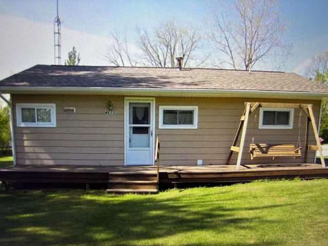 4633 Angling Rd, Silverwood, MI 48760 - rear view of house with a deck and a lawn