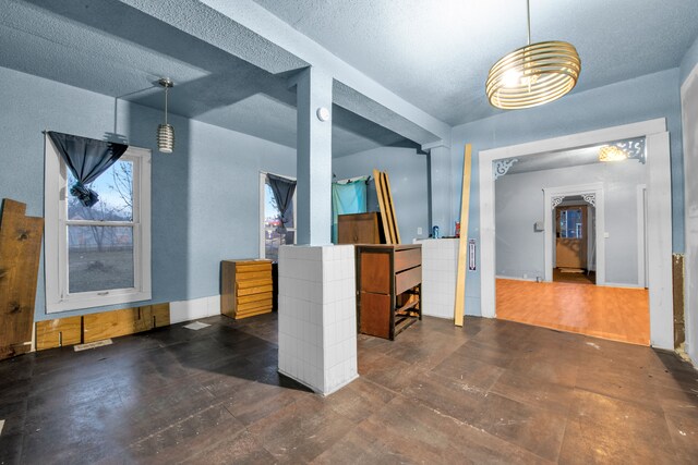 interior space with a textured ceiling