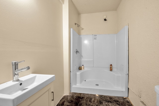 full bathroom with vanity and walk in shower