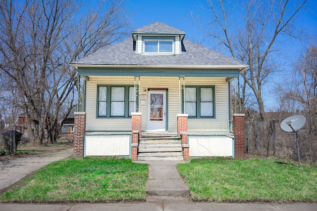 13057 Chelsea St, Detroit, MI 48213 - bungalow-style home featuring a front yard, a shingled roof, and covered porch