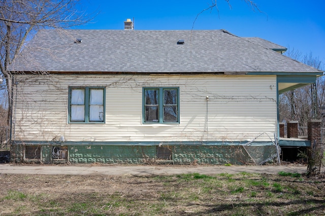 13057 Chelsea St, Detroit, MI 48213 - view of side of home with roof with shingles