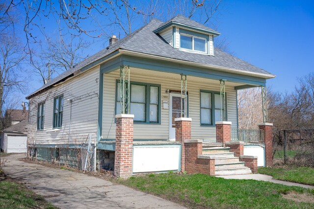 13057 Chelsea St, Detroit, MI 48213 - bungalow-style home featuring an outbuilding, covered porch, and roof with shingles