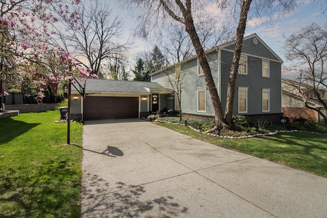 view of front facade with a front yard, concrete driveway, a garage, and brick siding