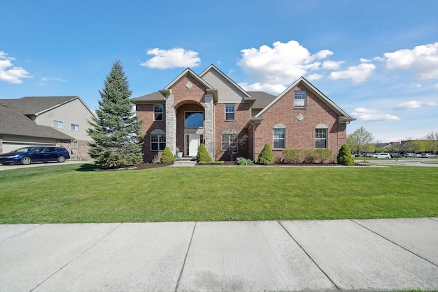 traditional home with a front lawn and brick siding