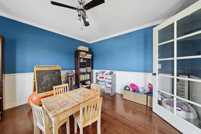 playroom with visible vents, a ceiling fan, wood-type flooring, and crown molding