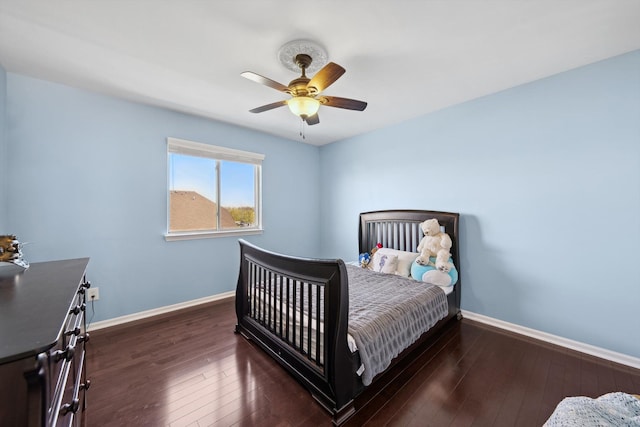 bedroom with baseboards, a ceiling fan, and hardwood / wood-style floors