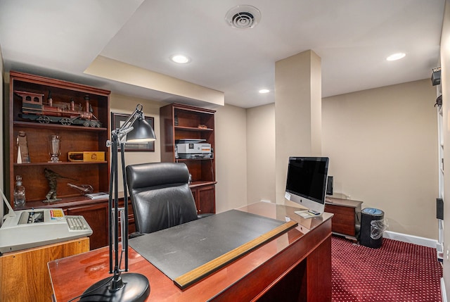 office area with recessed lighting, visible vents, dark colored carpet, and baseboards