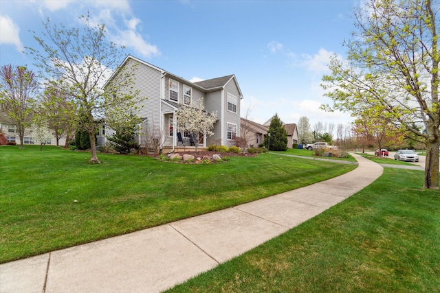 view of home's community with a yard