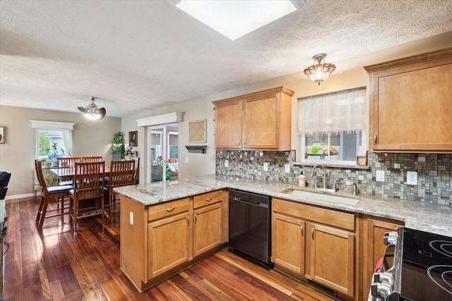 kitchen featuring electric range, a sink, black dishwasher, a peninsula, and tasteful backsplash
