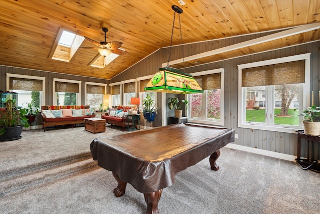 game room with vaulted ceiling with skylight, wood walls, carpet, pool table, and wooden ceiling
