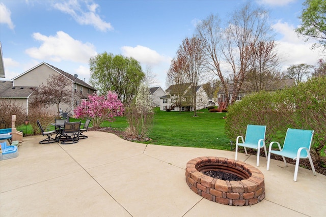 view of patio featuring outdoor dining area and a fire pit