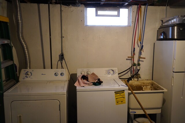 20115 Santa Barbara Dr, Detroit, MI 48221 - clothes washing area featuring independent washer and dryer, laundry area, and a sink