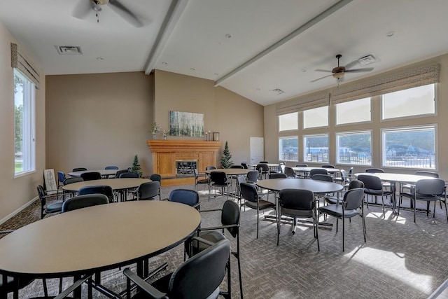 carpeted dining room featuring beamed ceiling, ceiling fan, high vaulted ceiling, and visible vents