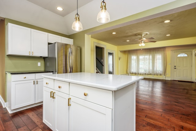 33 N Church St, Ortonville, MI 48462 - kitchen featuring a ceiling fan, white cabinetry, freestanding refrigerator, open floor plan, and dark wood finished floors
