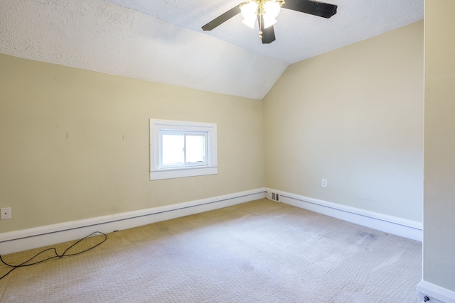 33 N Church St, Ortonville, MI 48462 - carpeted empty room with lofted ceiling, a textured ceiling, ceiling fan, and baseboards