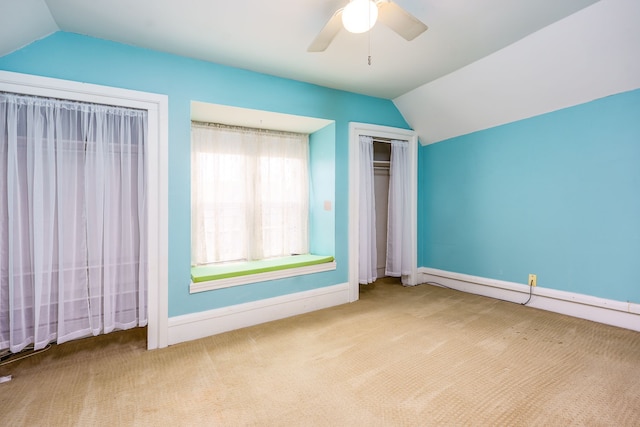 33 N Church St, Ortonville, MI 48462 - unfurnished bedroom featuring baseboards, carpet floors, a closet, and lofted ceiling