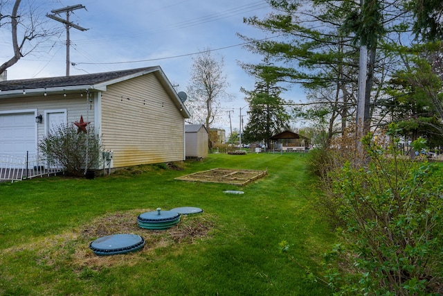 33 N Church St, Ortonville, MI 48462 - view of yard featuring an outdoor structure