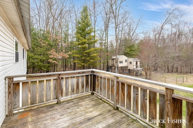 wooden deck featuring an outbuilding