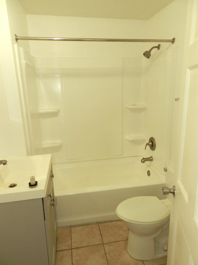 1187 Villa Ct, Benton Harbor, MI 49022 - bathroom with toilet, tile patterned floors, shower / bathing tub combination, and vanity