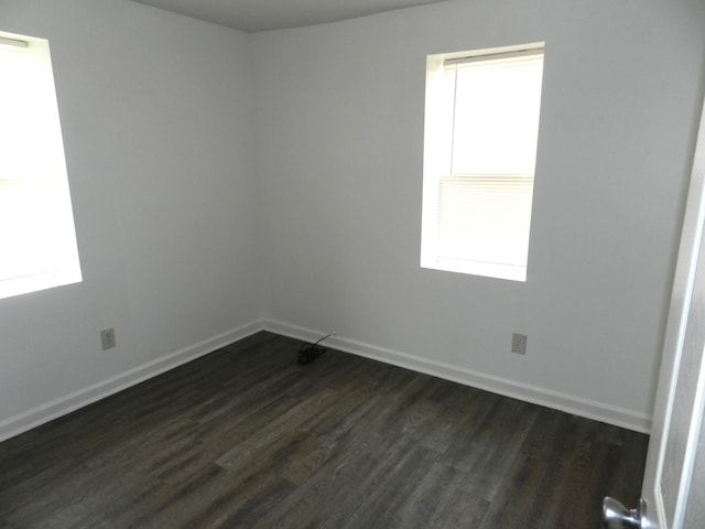 1187 Villa Ct, Benton Harbor, MI 49022 - empty room with dark wood-type flooring and baseboards