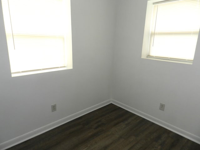 1187 Villa Ct, Benton Harbor, MI 49022 - empty room featuring dark wood-style flooring and baseboards