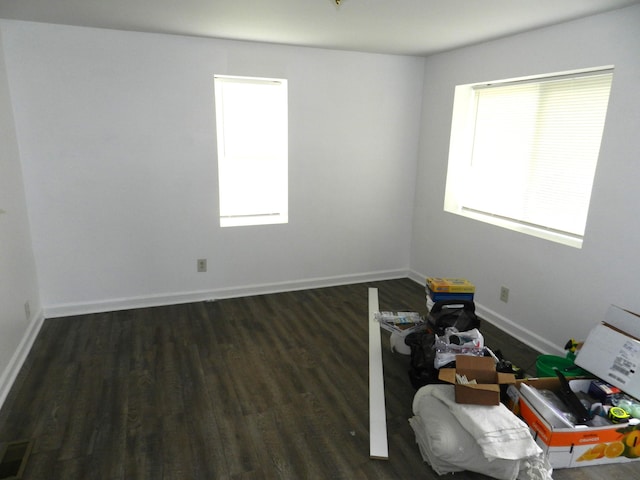 1187 Villa Ct, Benton Harbor, MI 49022 - empty room featuring plenty of natural light, visible vents, baseboards, and wood finished floors