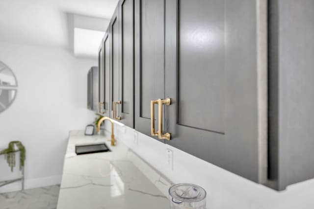 interior details with a sink and baseboards
