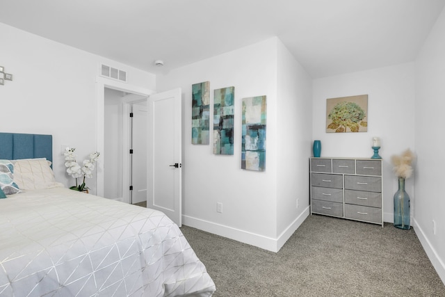 carpeted bedroom featuring visible vents and baseboards