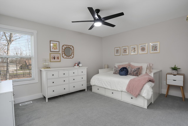 21907 Westcroft Dr, Grosse Ile, MI 48138 - bedroom featuring light carpet, visible vents, multiple windows, and baseboards