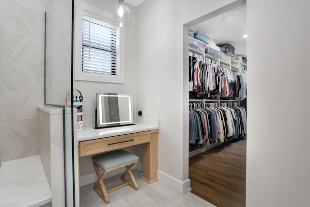 21907 Westcroft Dr, Grosse Ile, MI 48138 - walk in closet with light wood-type flooring