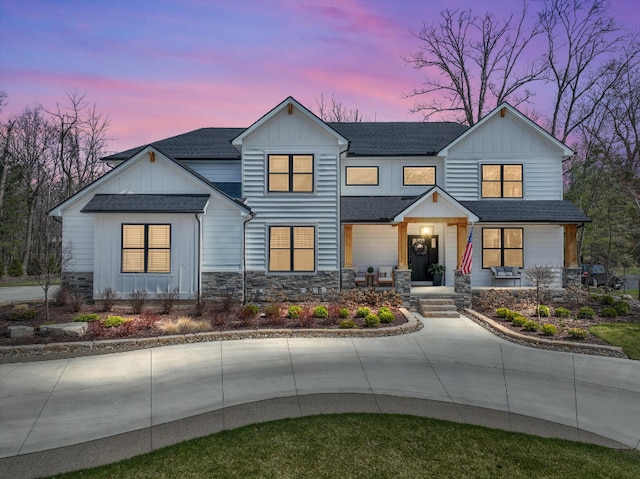 21907 Westcroft Dr, Grosse Ile, MI 48138 - modern farmhouse featuring board and batten siding, stone siding, and roof with shingles