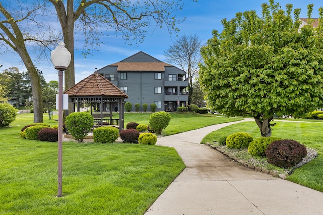 view of home's community with a gazebo and a lawn