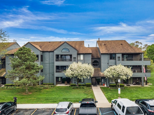 view of property with uncovered parking