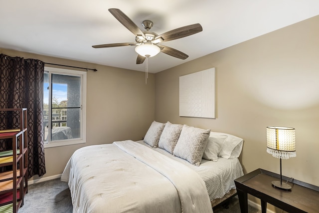 carpeted bedroom with baseboards and ceiling fan